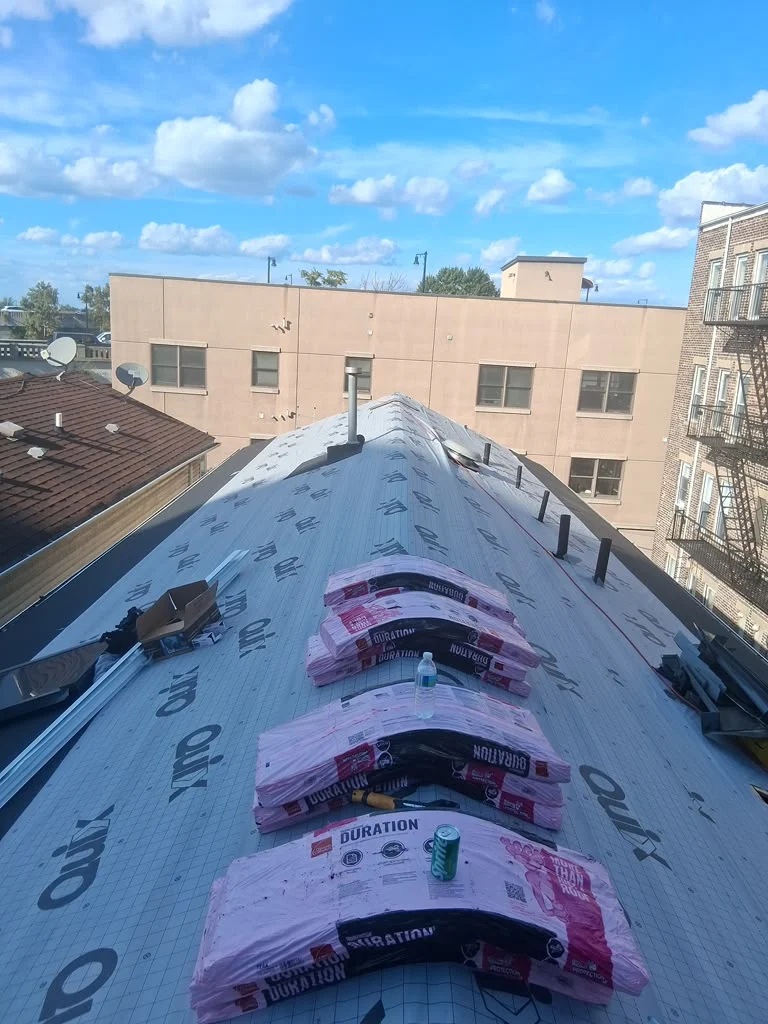 Old deteriorated roof deck exposed during a Jersey City roof tear-off