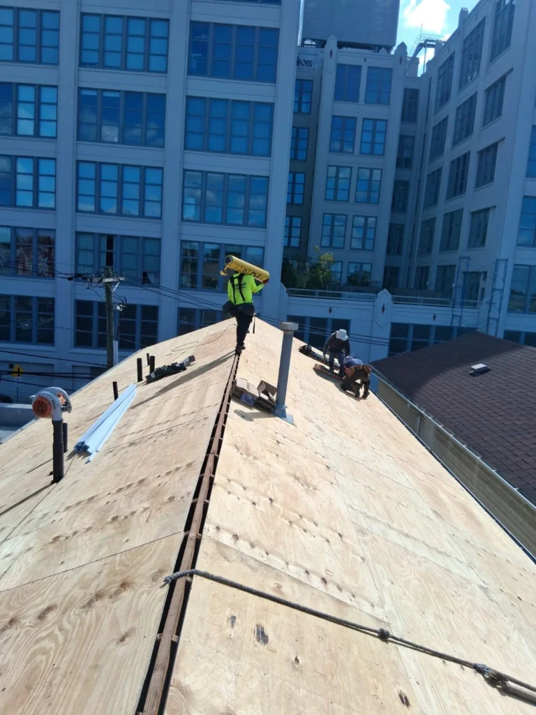 New plywood roof deck installed before shingle installation in Jersey City