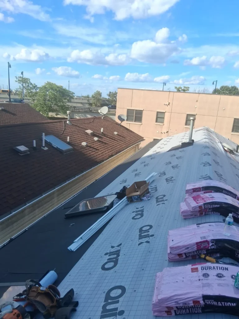 Synthetic underlayment and roofing materials on a Jersey City hip roof
