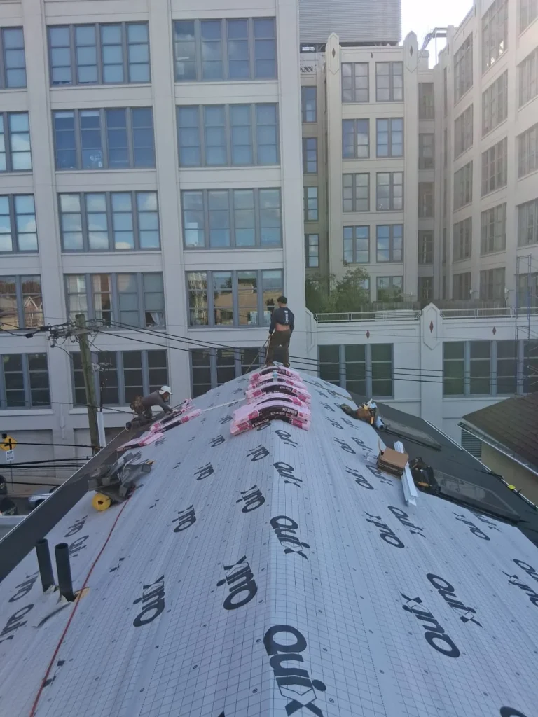 Roofing work in progress on a multifamily building in Jersey City NJ