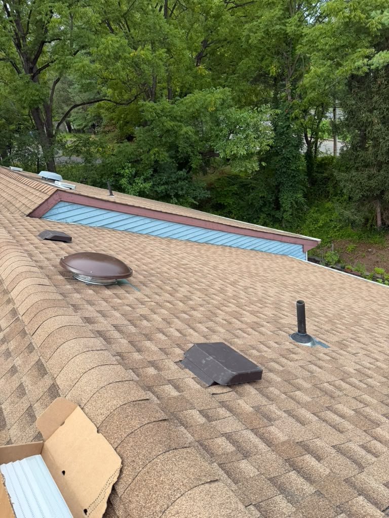 Completed North Brunswick residential roof replacement with vent flashing