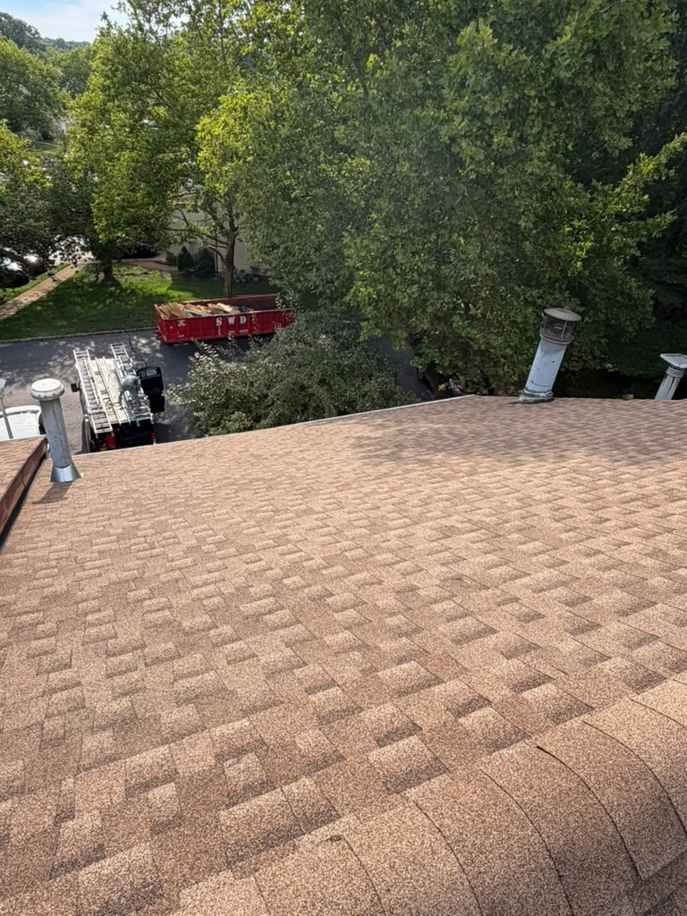 Finished tan architectural shingles on a North Brunswick home