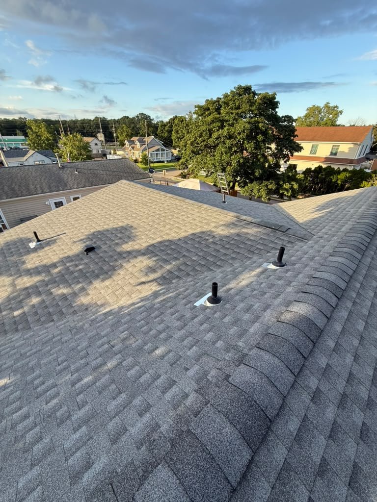 Completed multi-plane roof replacement with new ridge caps in Toms River