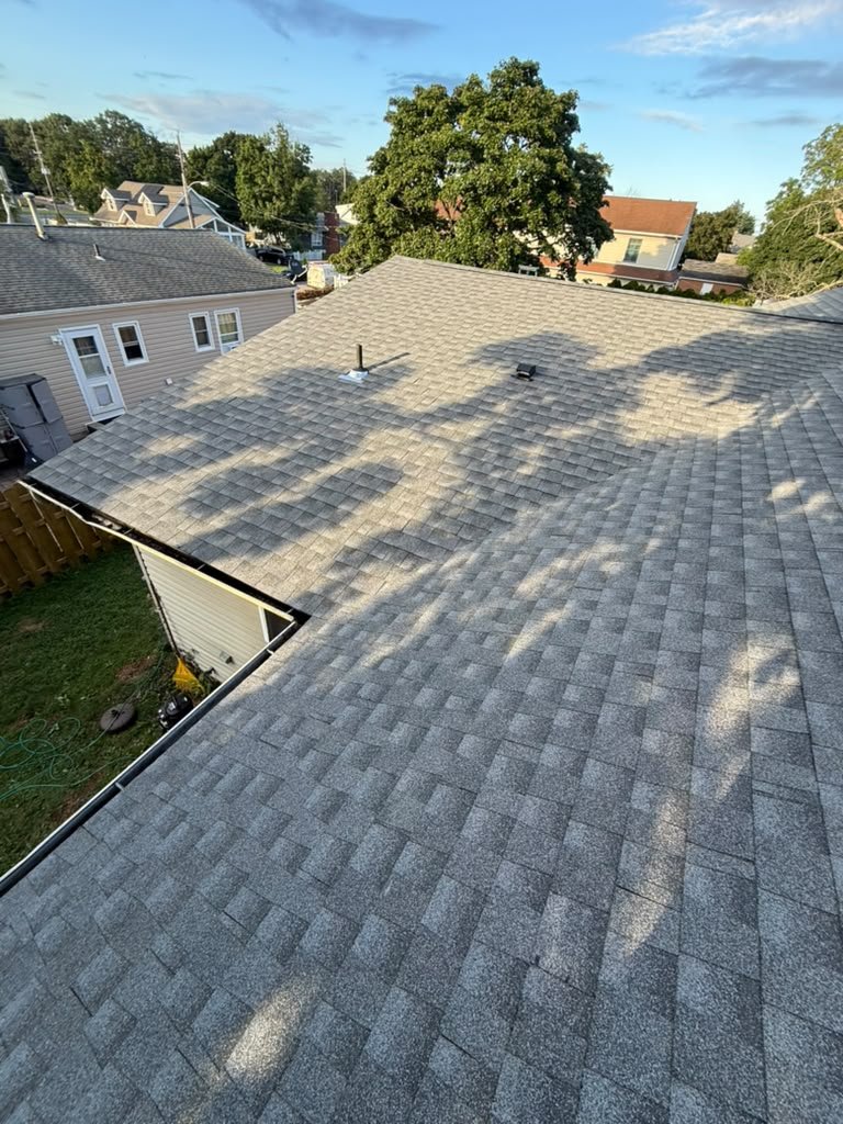 Completed gray shingle roof and vent details in Toms River