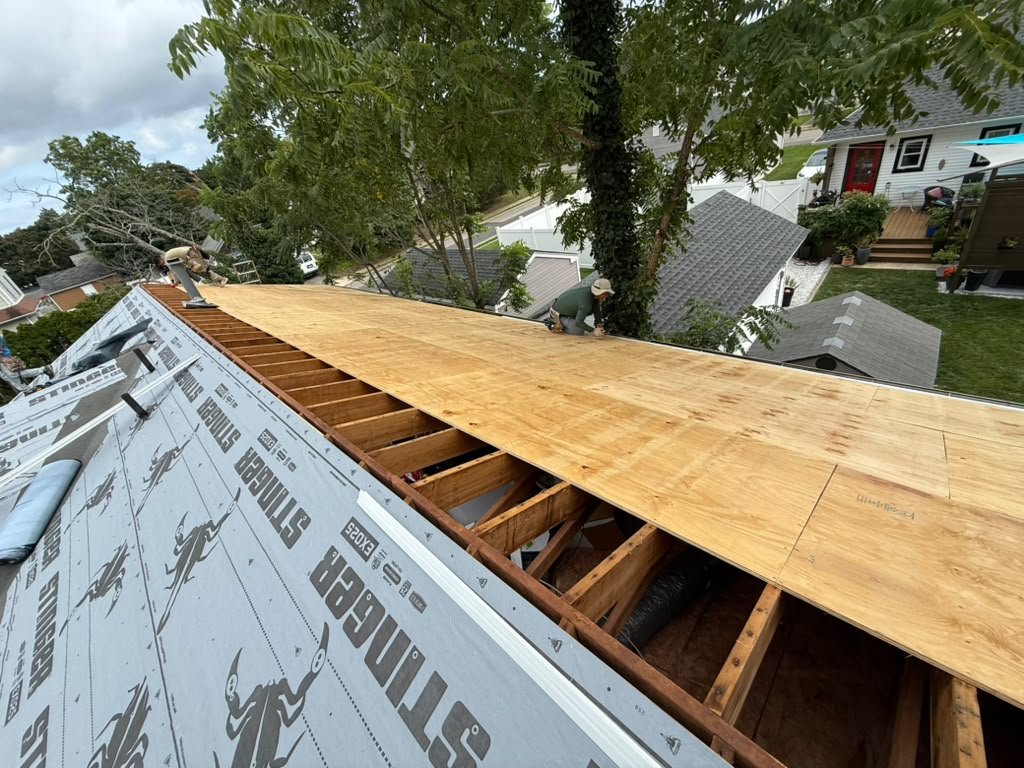 New plywood roof decking and STINGER EXO25 underlayment during a Toms River roof replacement