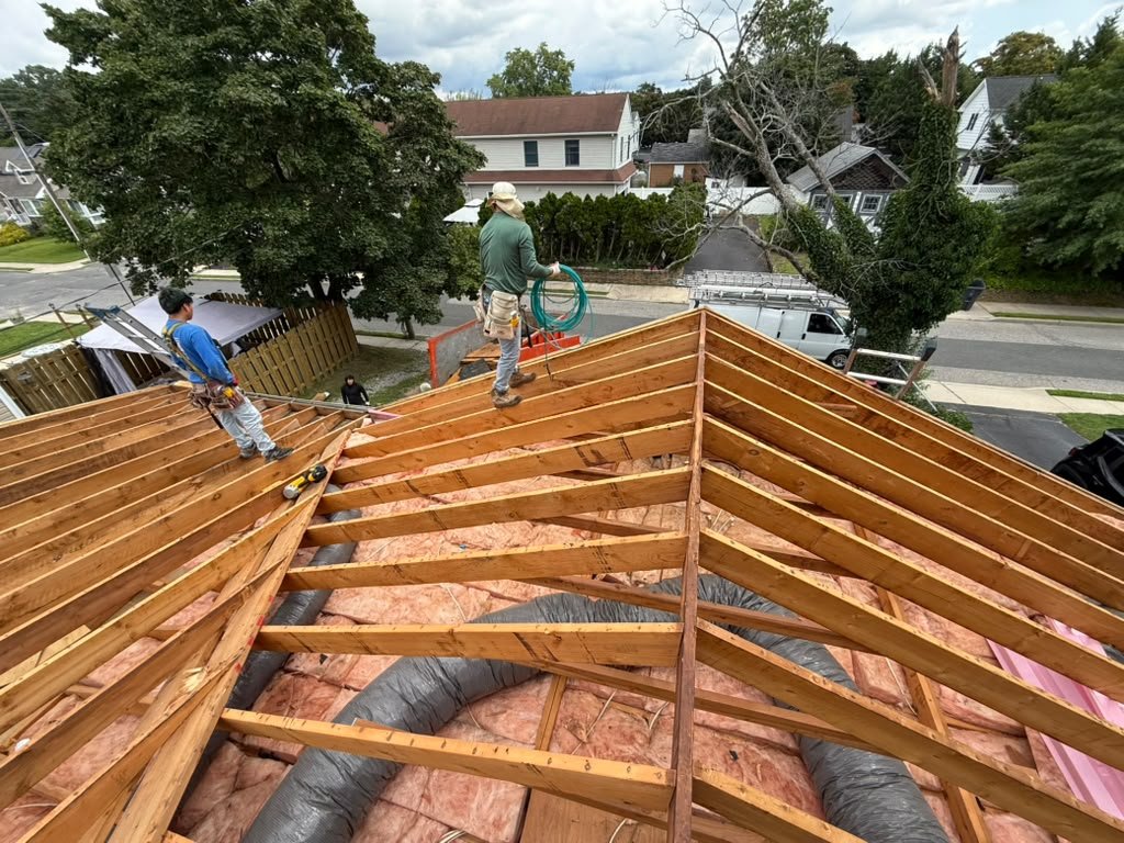 Existing roof framing and insulation during a Toms River roof replacement