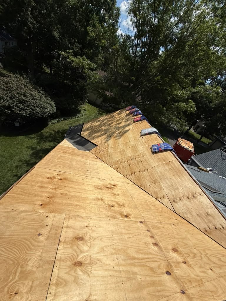 New plywood roof decking across multiple Whiting roof sections