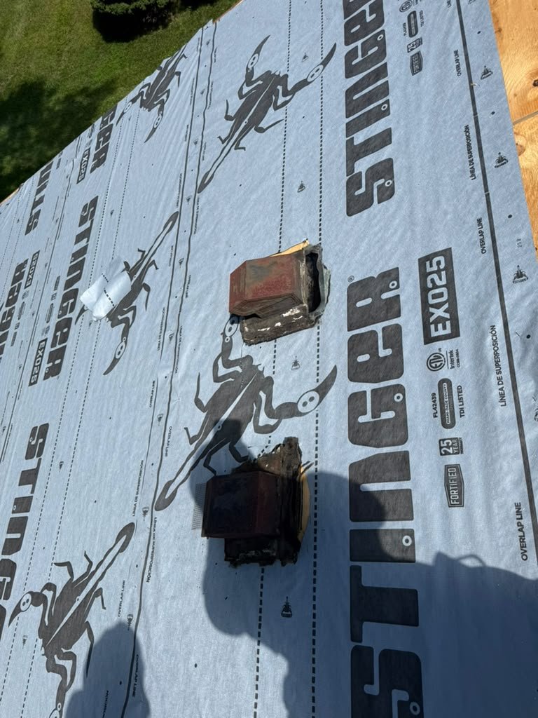Roof flashing and penetration preparation during a Whiting roof replacement