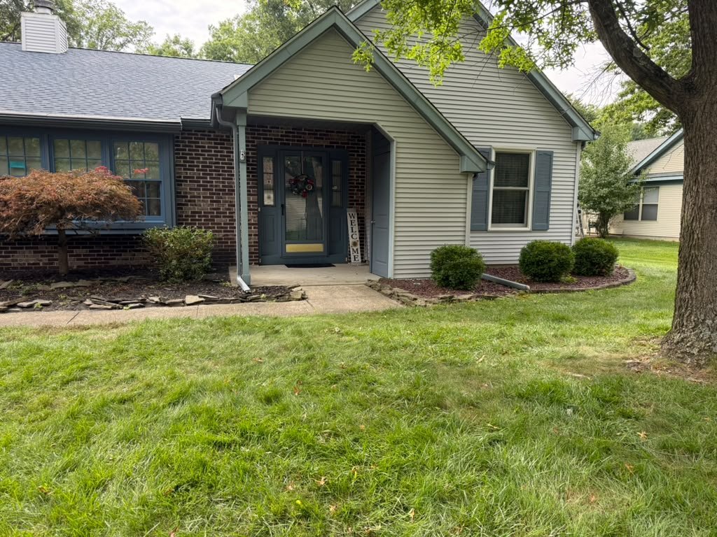 Whiting residential home after a completed architectural shingle roof replacement