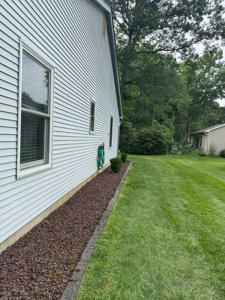 Completed roof replacement and exterior drainage details in Whiting