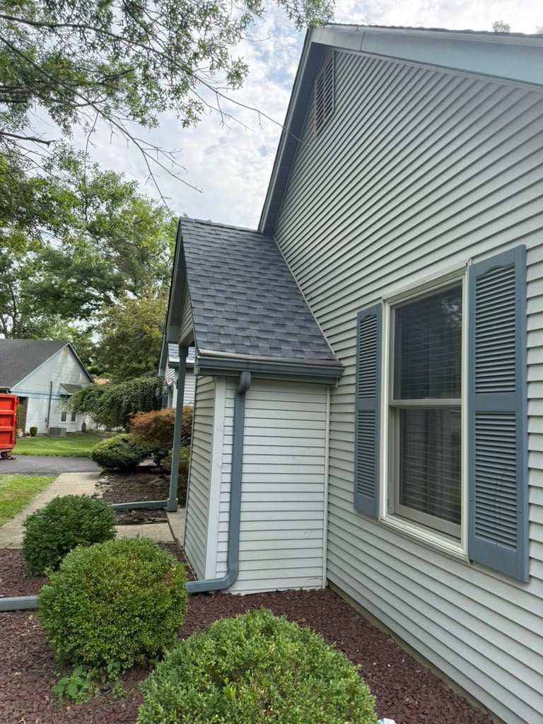 Completed architectural shingle roof and side elevation in Whiting