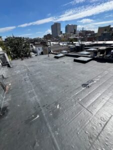 Completed black EPDM flat roof across a Hoboken NJ multifamily property