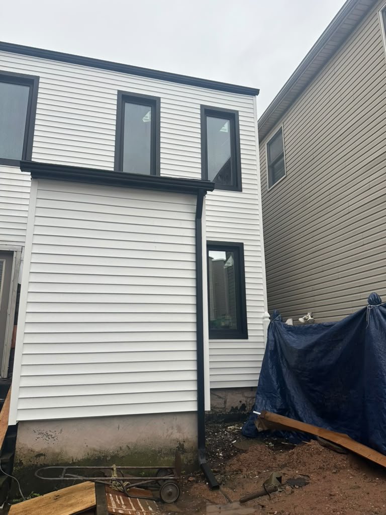 White Vinyl Siding Replacement and Board-and-Batten Exterior Renovation in Weehawken, NJ