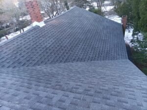 Wide view of a completed charcoal architectural shingle roof in Westwood New Jersey