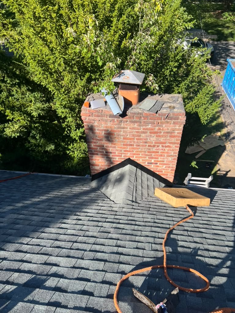 Chimney flashing and architectural shingles on a Wyckoff NJ roof replacement