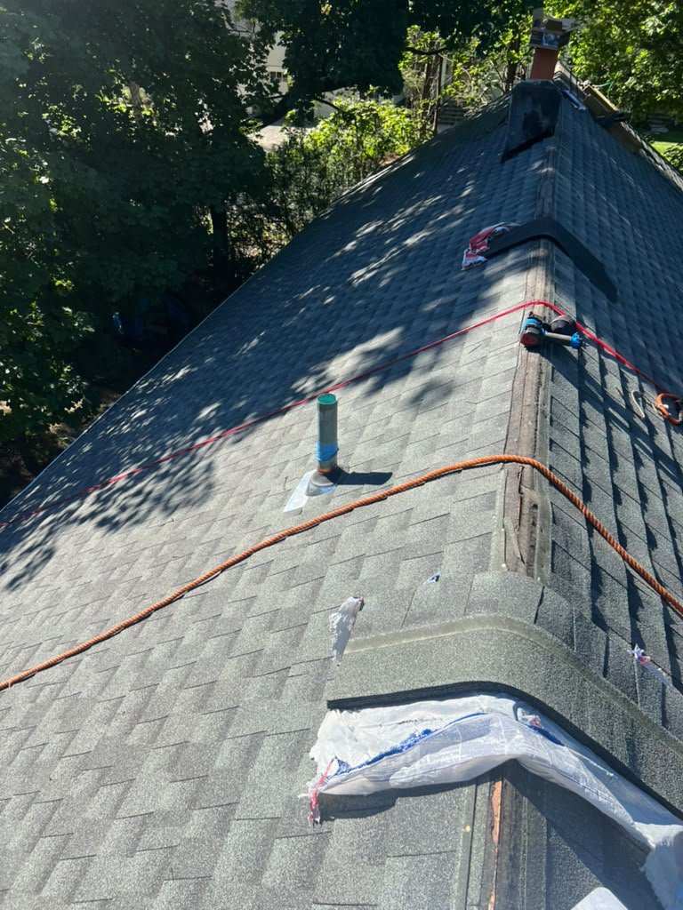 Finished architectural shingle roof with sealed roof vent and ridge cap in Wyckoff NJ